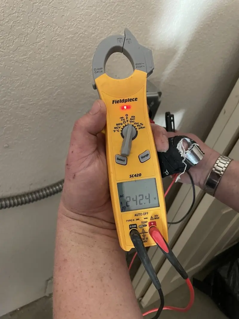 Voltage testing with clamp meter during Electrical Installation Services in Smiths Station